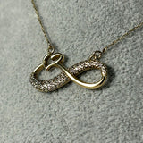 Colier din aur 14K cu simbol infinit, inimă și pietre decorative – 2,46 g
